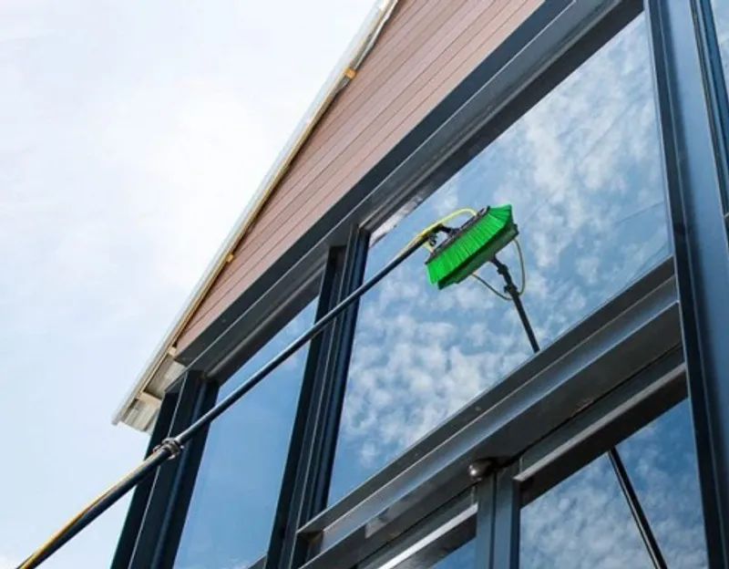 Water-fed pole cleaning third floor windows in San Francisco